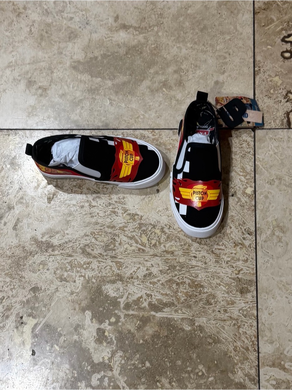 Ground Up Cars Piston Cup Slip-On Sneakers with Red & Yellow Piston Cup Graphic